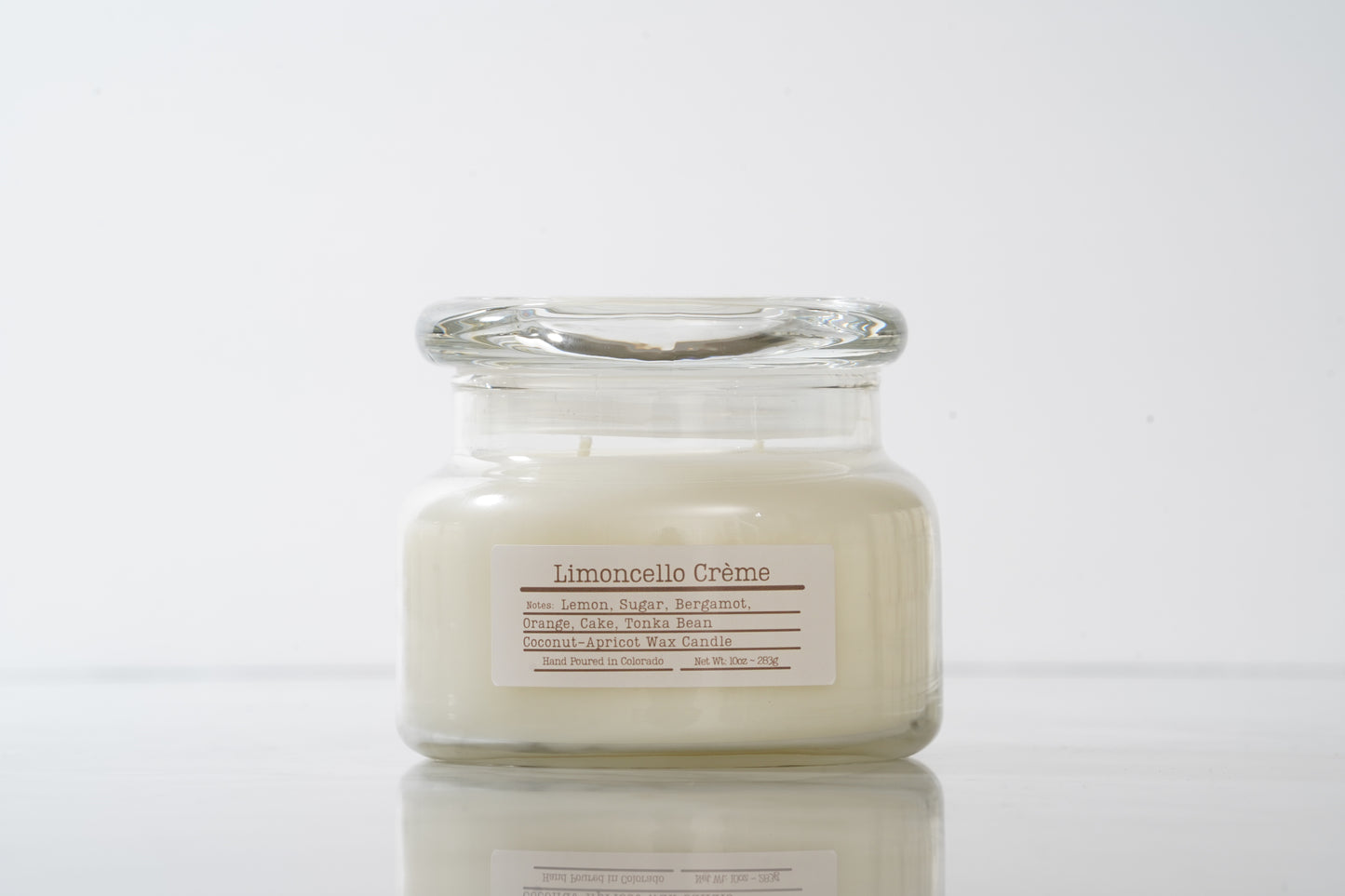 Limoncello creme labeled scented glass candle with lid