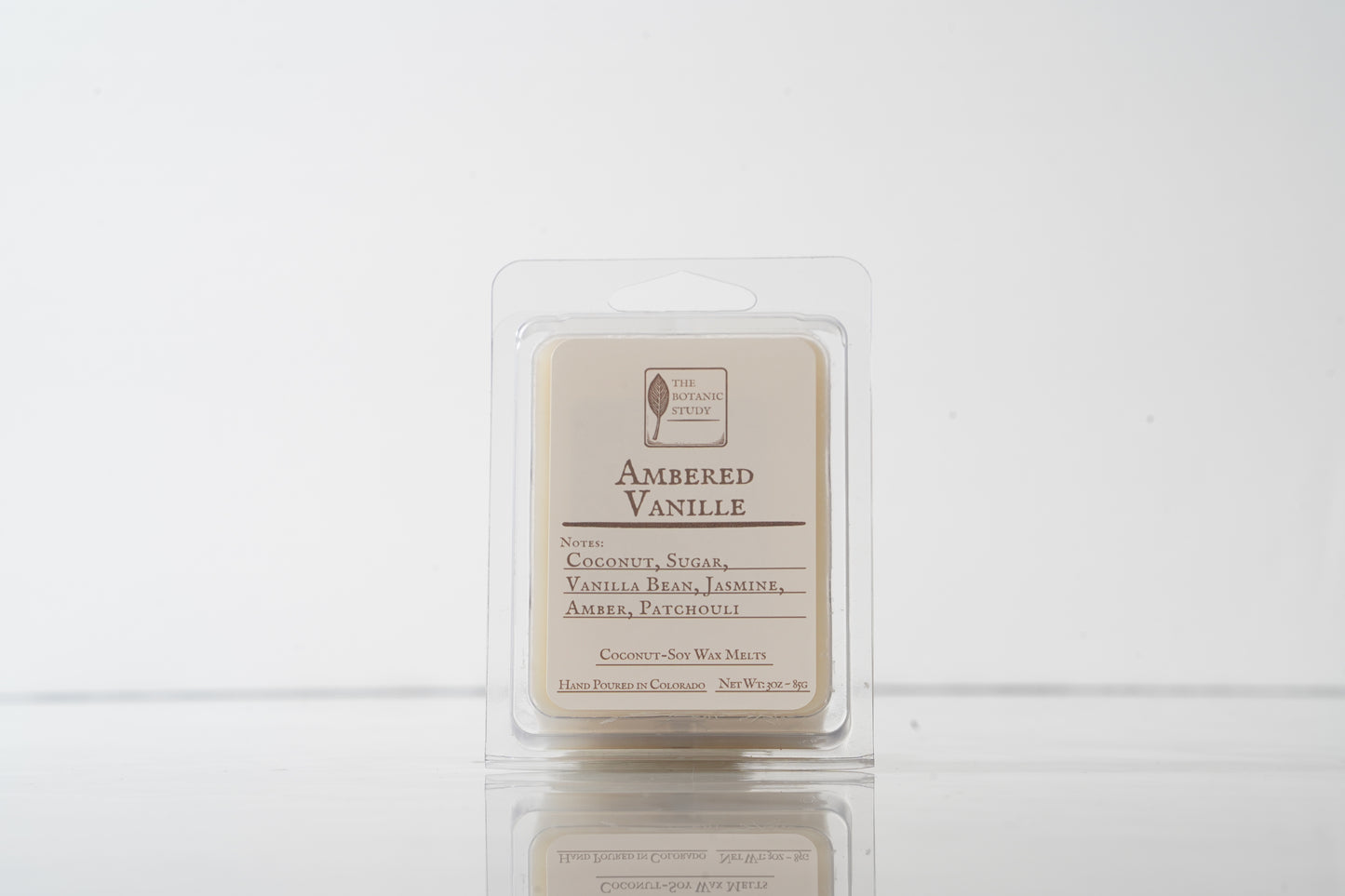 Ambered Vanille wax melt packaging on a white background